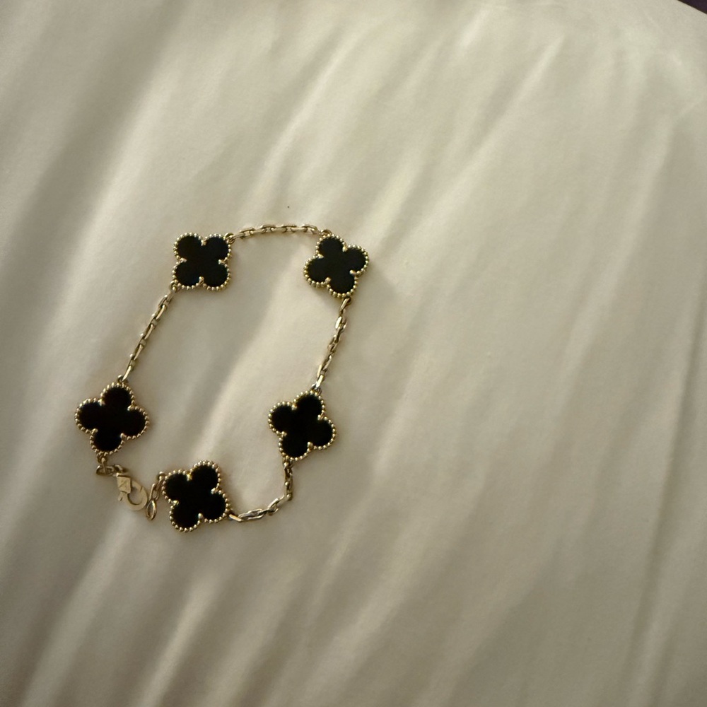 Elegant Black and Gold Clover Bracelet